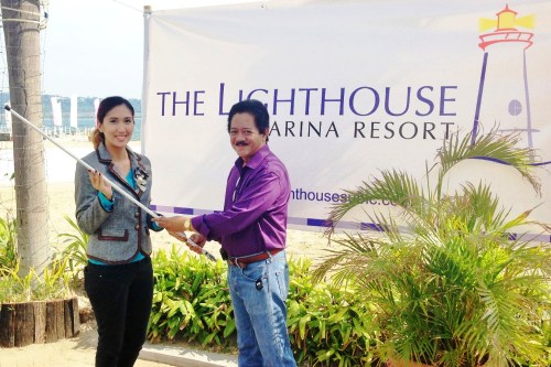 SBFCC president Danny Piano turns over an Automatic Identification System antenna to Jozen Curva, Public Relations Officer of The Lighthouse Marina Resort.