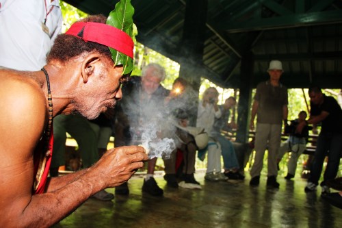 An Ayta tribesman demonstrates fire-making techniques to foreign tourists at the Pamulaklakin Ayta Village in the Subic Bay Freeport where a month-long program has been organized by the SBMA to celebrate the Indigenous People's Month.
