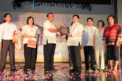 SBMA Chairman and Administrator Roberto V. Garcia hands presents the award to Edmond De Jesus of the SBMA Ecology Center, who was named one of the winners in the search for the Ten Outstanding Freeport Workers for 2013. The recognition rites was held at the Subic Bay Arts Center on Friday, November 22, 2013.