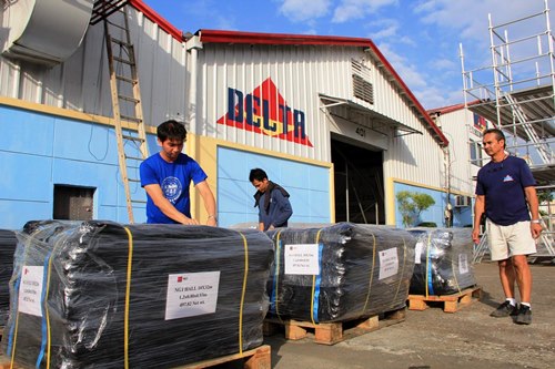 Jon Allen Eschenburg (right), sales and special project manager of Delta Production Philippines Corp., supervises the preparation of collapsible tents to be shipped to Eastern Visayas for use as mobile hospitals and other temporary shelters for victims and relief crew in areas devastated by Typhoon Yolanda.