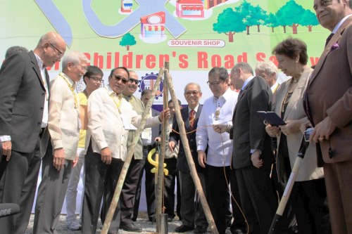 SBMA Chairman Roberto V. Garcia (left) and Jean Todt, president of the Federation Internationale de Automobile, lower a time capsule during the groundbreaking ceremony of the AAP Children's Road Safety Park at the Subic Bay Freeport.  Looking on are: Tourism Secretary Ramon Jimenez, International School of Sustainable Tourism president Mina Gabor, and other delegates to the ongoing Asia-Pacific Drive Tourism Conference at the Subic Bay Exhibition and Convention Center.