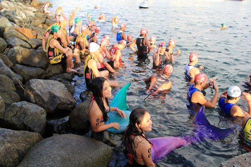 "Mermaids" and "Ironman" on flyboard provide entertainment for spectators and triathletes at the start of the 2014 Century Tuna 5i50 Triathlon held at the Subic Bay Freeport on June 29.