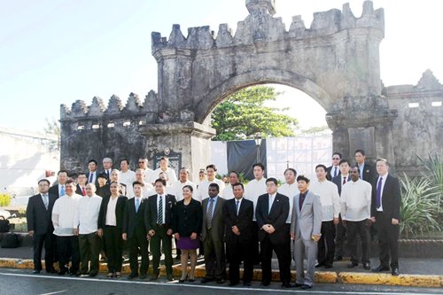Delegates to the 16th General Assembly and Symposium of the International Network of Affiliated Ports (INAP), pose for a ceremonial photo opportunity at the historic Spanish Gate in the Subic Bay Freeport during the opening of the three-day conference. The three-day conference will focus on port innovations and the promotion of competitiveness, productivity and regional cooperation.