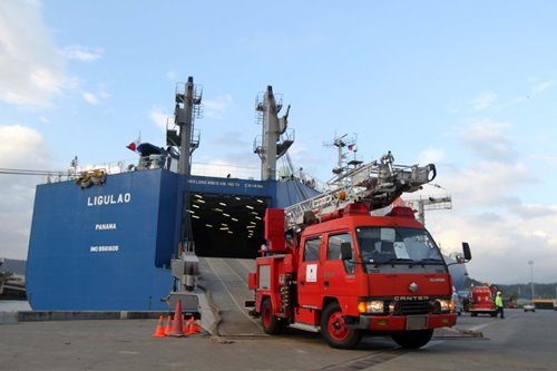 A firetruck goes down the ramp of MV Ligulao, a Panamanian-registered vehicles-carrier ship, which unloaded emergency vehicles at the NSD Pier of the Subic Bay Freeport on Tuesday afternoon. A total of three ambulances and 17 firetrucks arrived in Subic as donation from the Japanese government to areas affected by Typhoon Yolanda in the Visayas.