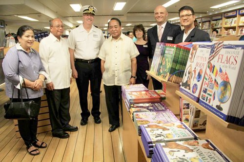 SBMA Chairman Roberto V. Garcia (center), flanked by wife Maribi and Zambales Vice Gov. Ramon Lacbain II,  Central Luzon Tourism Director Ramon Tiotuico (right) and Logos Hope HR director Andy Juliet, cut the ceremonial ribbon as ship captain James Dyer looks on during a ceremony to formally open the floating bookstore to the public on Tuesday.