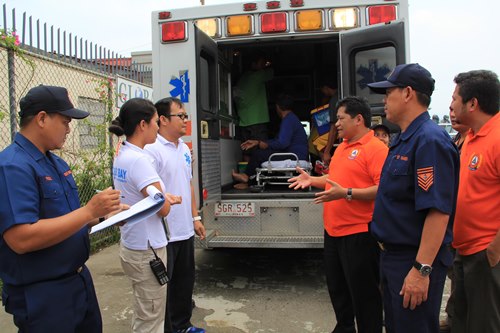 The SBMA medical and rescue team, along with SBMA Senior Deputy Administrator Randy Escolango (4th from left), attend to the rescued fishermen upon arrival at the Subic Bay Freeport.