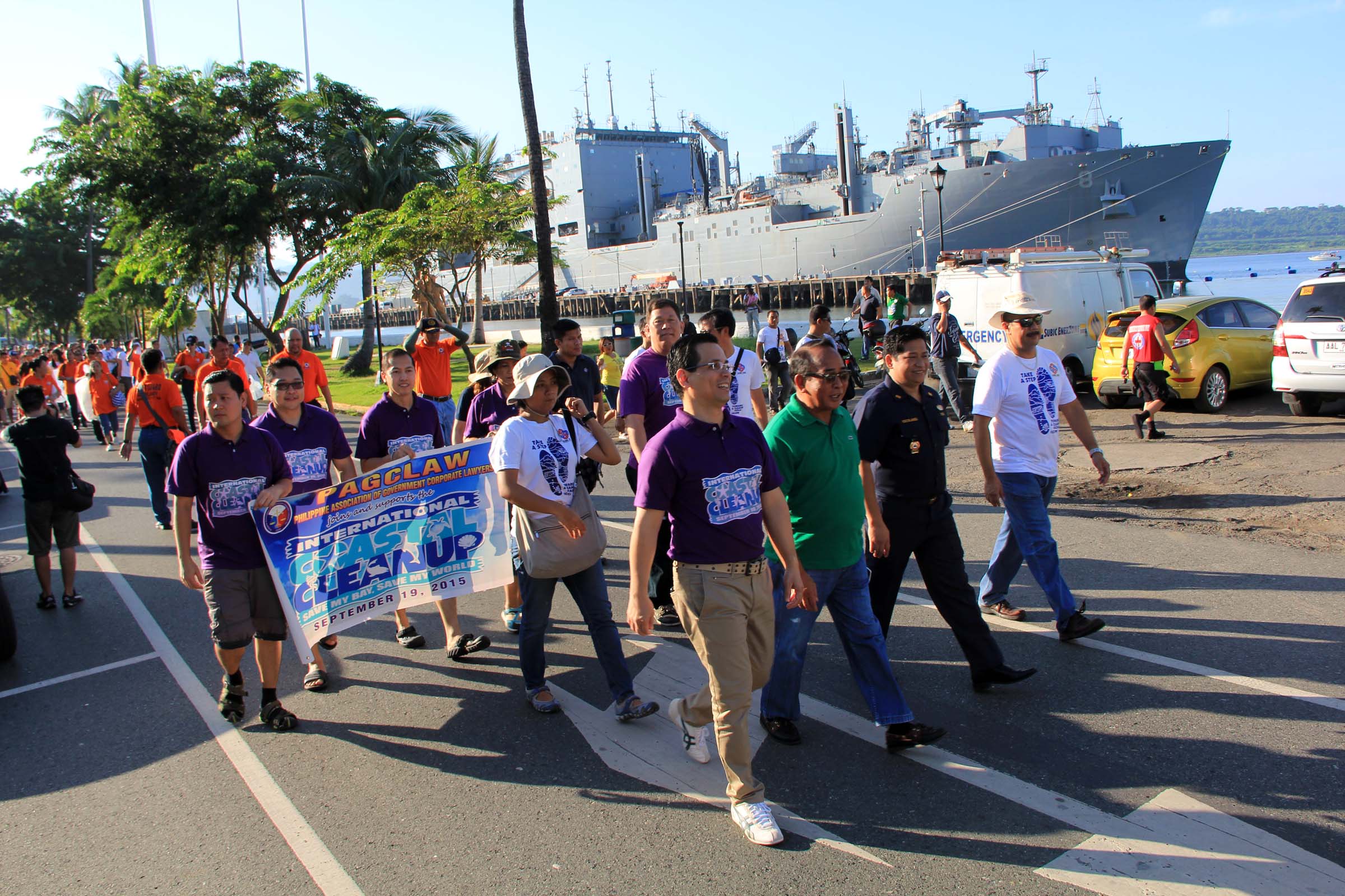 Justice Raoul Creencia (left), government counsel at the Office of Government Controlled Corporations, joins SBMA Chairman Roberto Garcia and other SBMA officials in a march to kick off the 2015 edition of the International Coastal Clean-up in the Subic Bay Freeport. With them are Deputy Administrator (SDA) for Legal Affairs Atty. Randy Escolango and SDA for Regulatory Group Atty. Chot Kabigting. More than 50,000 volunteers from Subic Bay Freeport, Olongapo City, and province of Zambales took part in the annual cleanup event.
