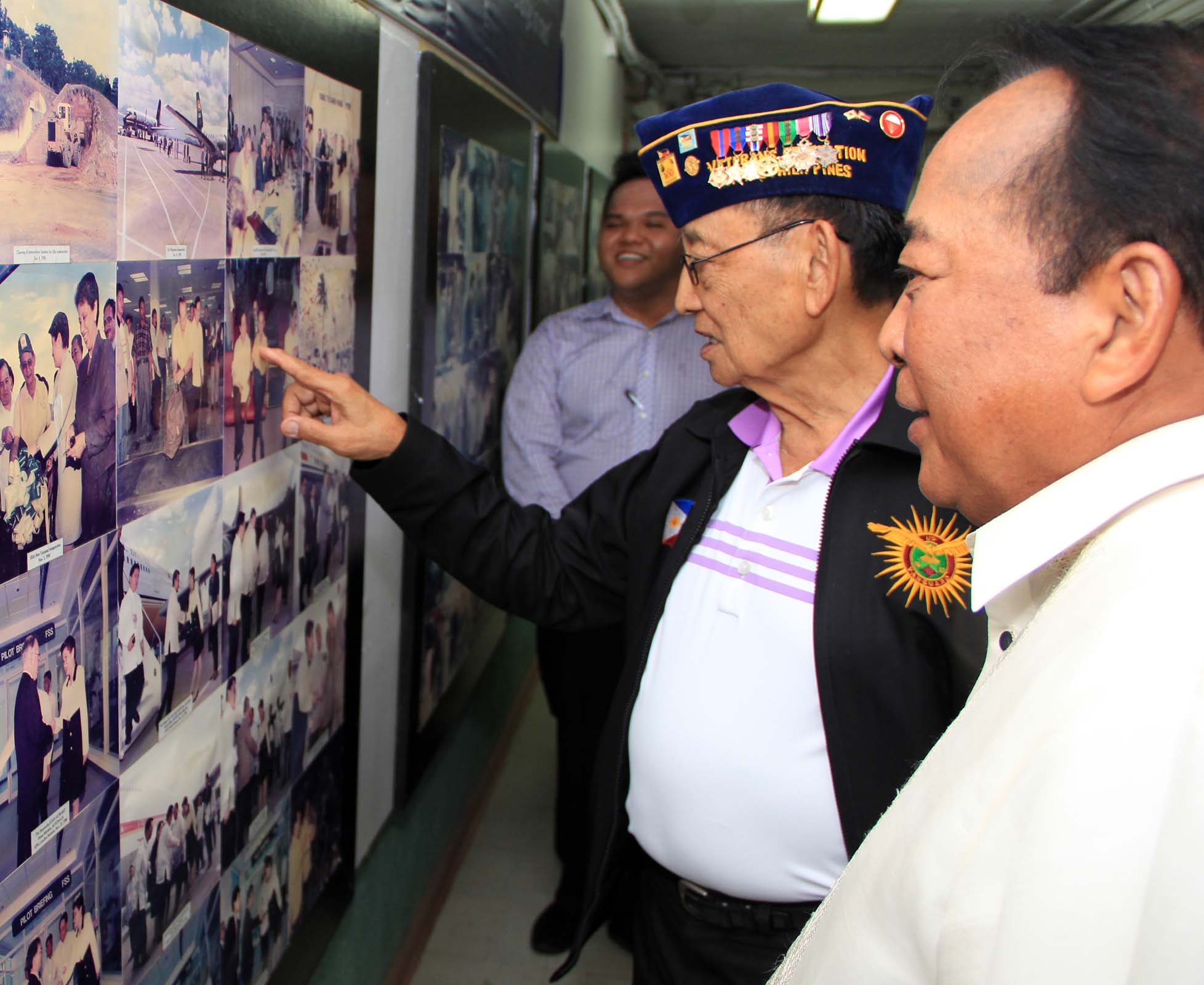 Former President Fidel V. Ramos views pictures on display at the SBMA office with SBMA Chairman Roberto V. Garcia during a visit to the Subic Bay Freeport recently.