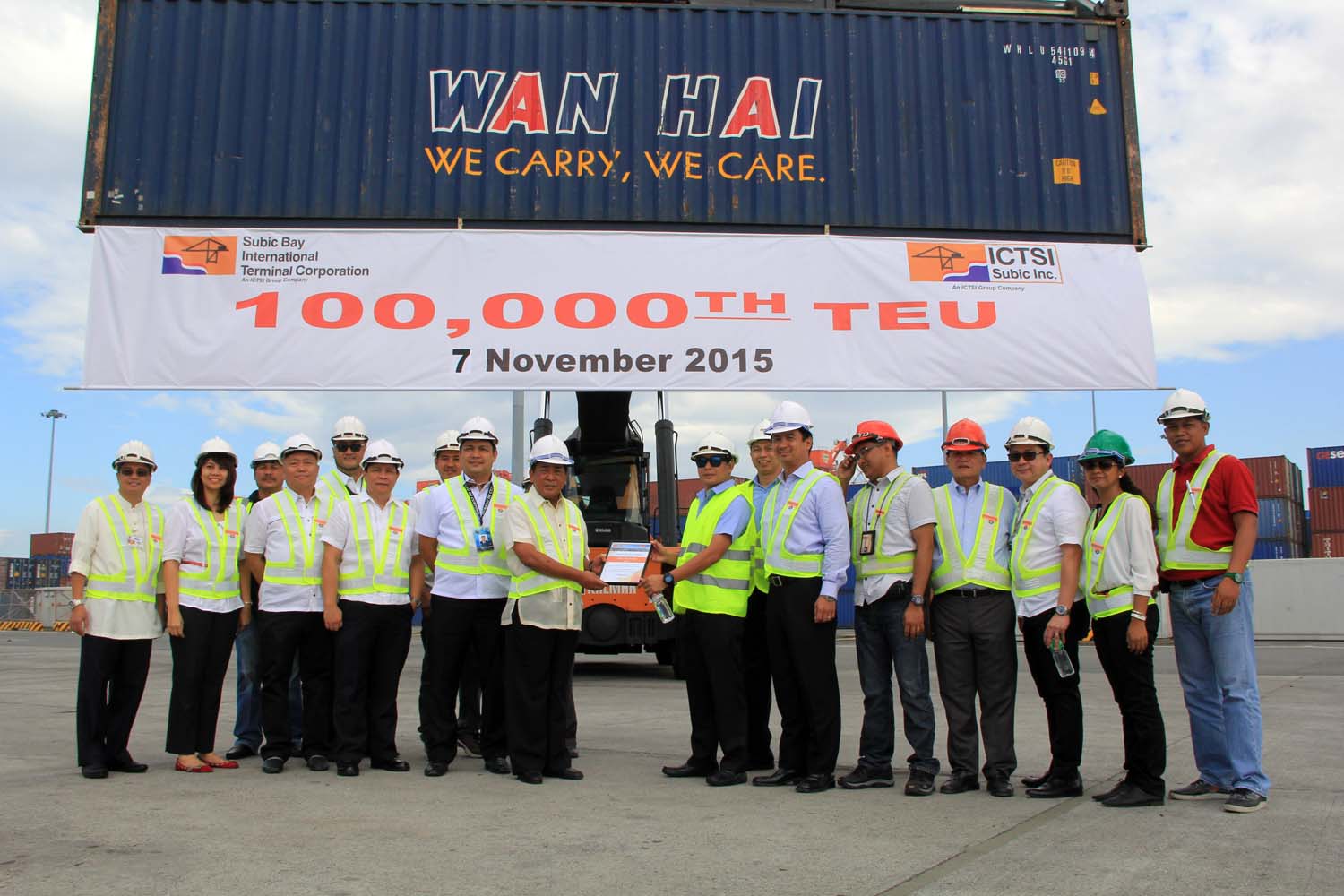 SBMA Chairman Roberto Garcia (middle, left) receives from SBITC general manager Roberto Locsin a copy of documents marking the arrival of the 100,000th TEU at the New Container Terminal 2 in Subic Bay Freeport.