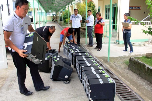 SBMA-MIS head Vergil Lansangan (4th from left) and other SBMA staff delivers computer units for use of schoolchildren in Balanga City. Other units will be donated to various schools in Olongapo City and Zambales.