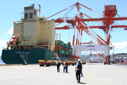 A commercial vessel unloads containerized cargo at Subicâ€™s New Container Terminal