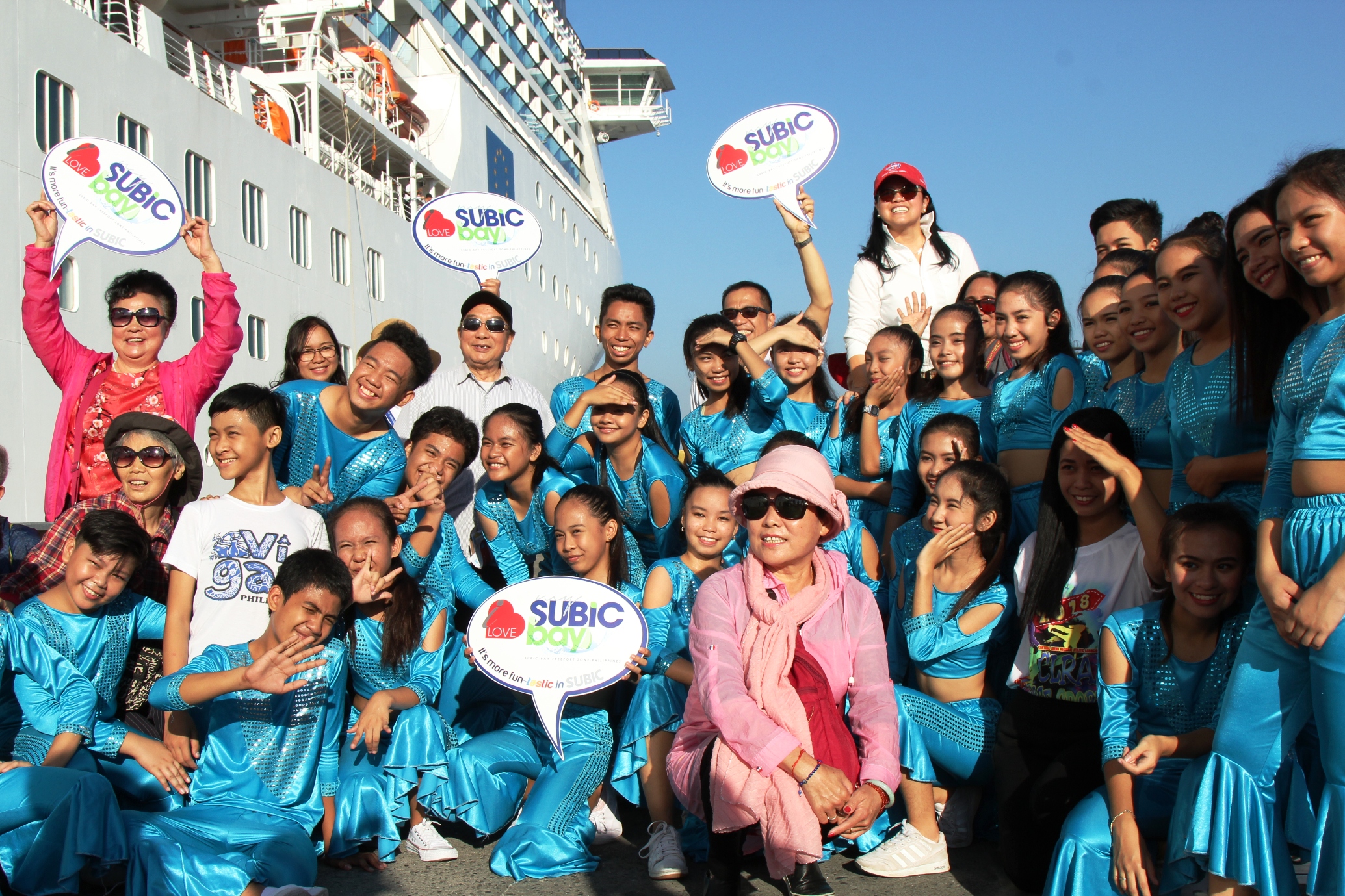 SBMA Chairman Wilma T. Eisma joins student-dancers in welcoming passengers of MV Costa Atlantica, an Italian-flagged cruise ship that docked in Subic Bay on March 6, 2018