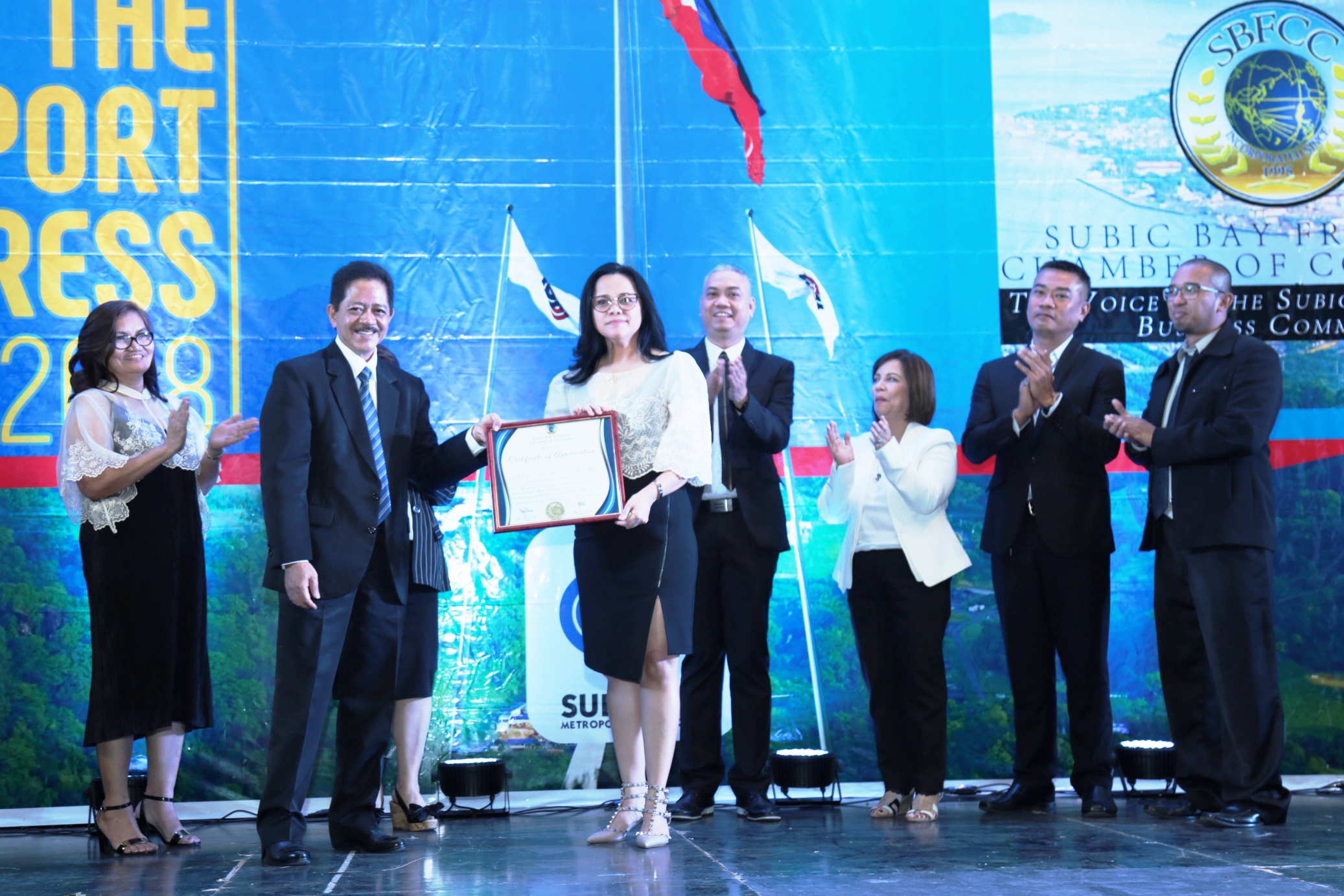 Chairman Eisma receives a token of appreciation from officials of the Subic Freeport business community after delivering her State of the Freeport Address last month.