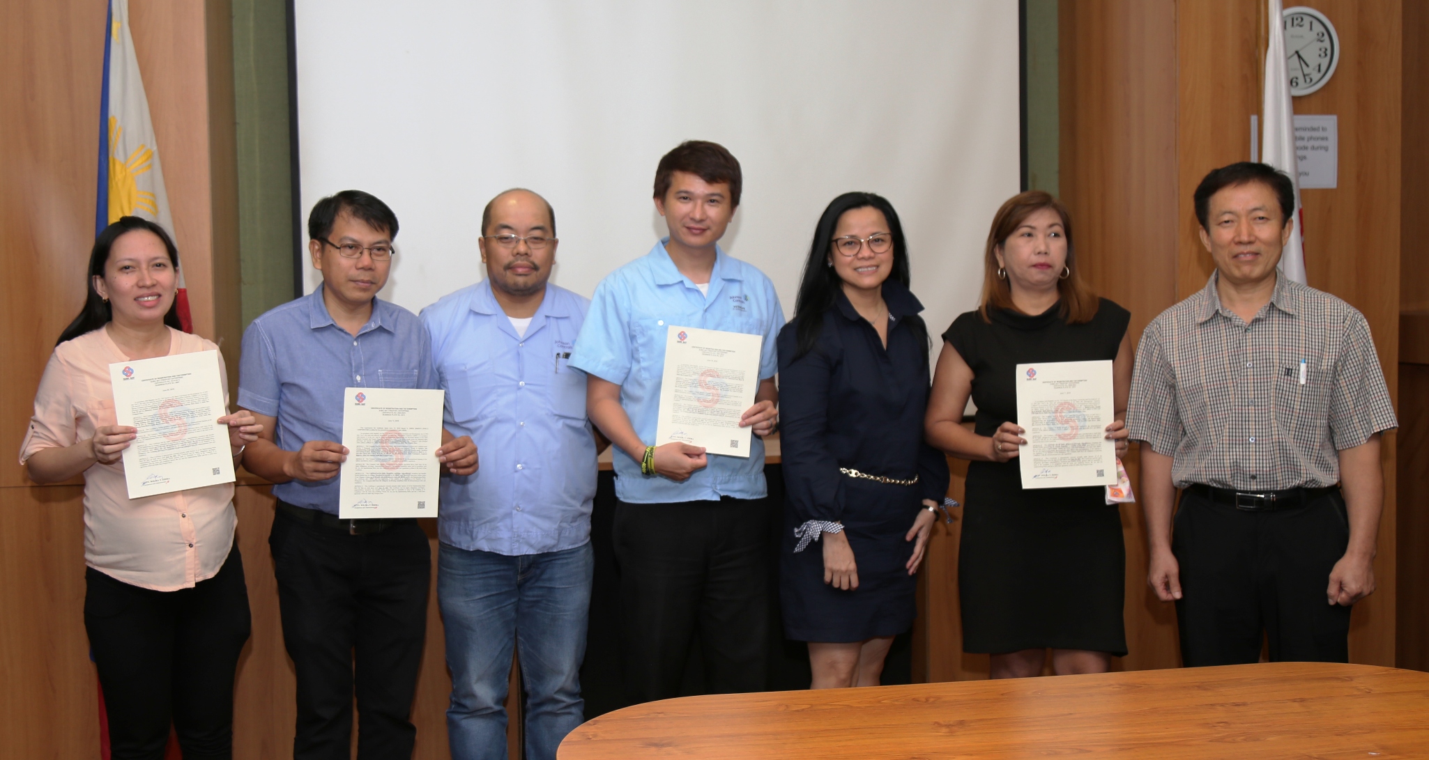SBMA Chairman and Administrator Wilma T. Eisma joins representatives of Subic-registered companies that received their 3-year CRTE from the Subic agency.