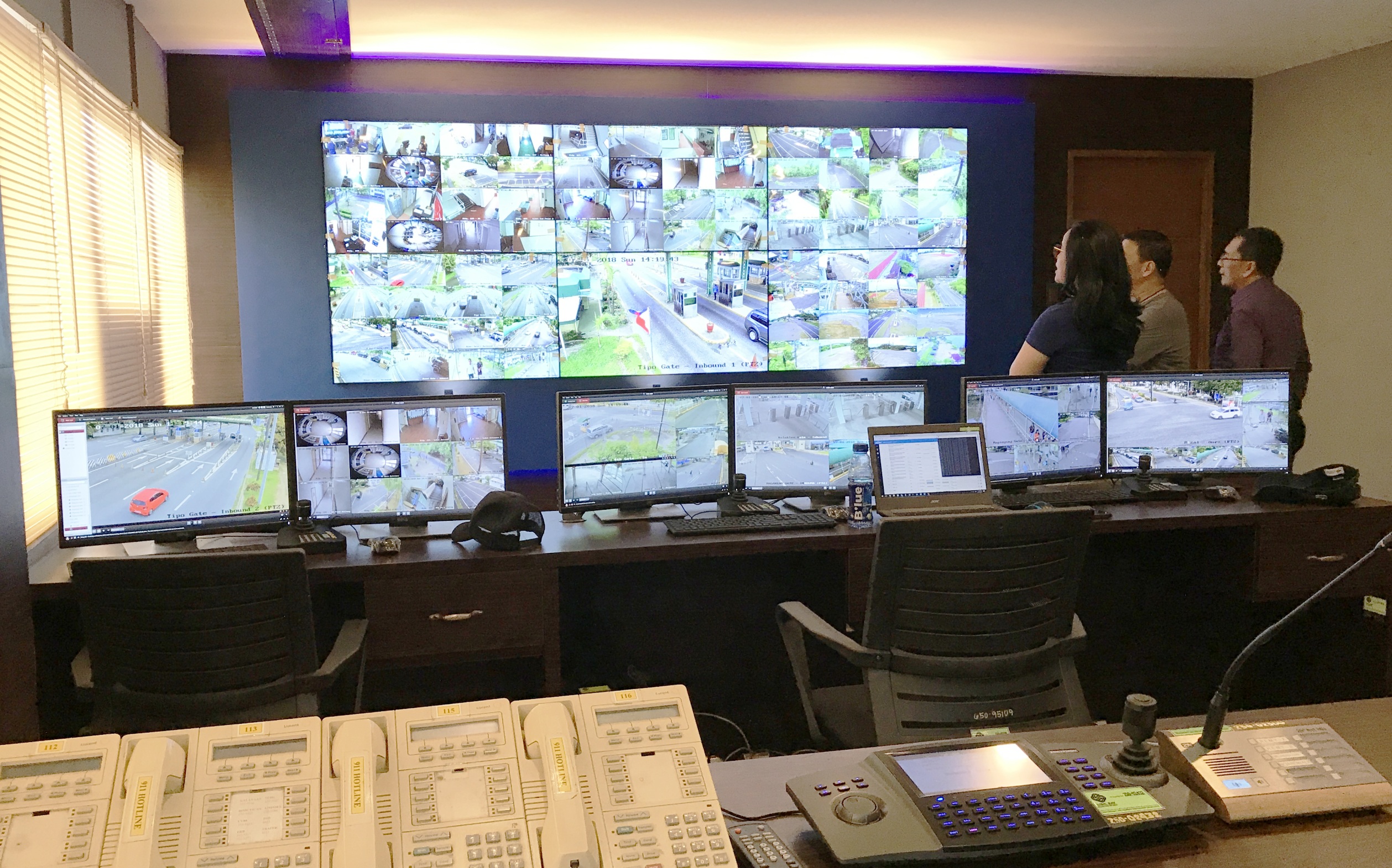 SBMA Chairman Wilma T. Eisma, along with other SBMA officials, views images fed live through a CCTV system at the SBMA Law Enforcement Departmentâ€™s control room on Sunday.