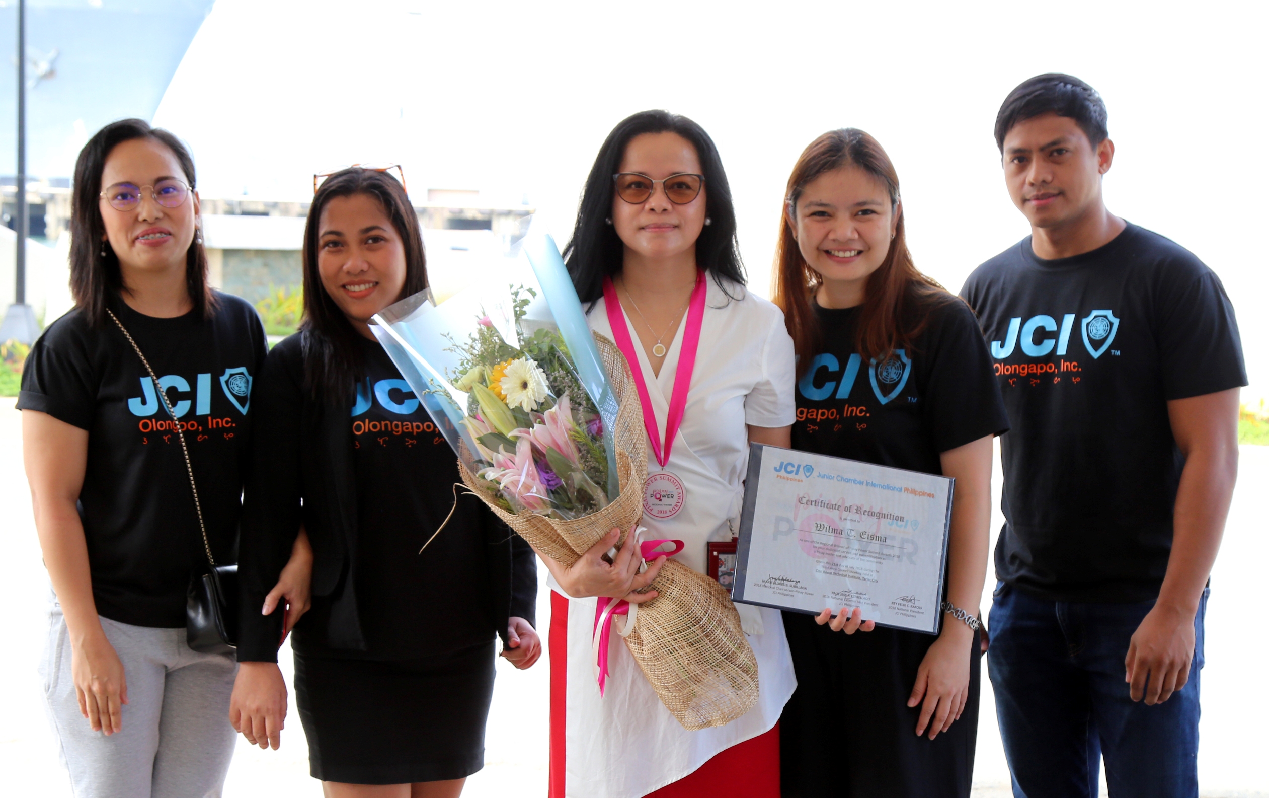SBMA Chairman and Administrator Wilma T. Eisma (center) receives her certificate of recognition as JCI â€˜Pinay Powerâ€™ awardee for Region 3 from (L-R): JCI Olongapo VP for Community  Ruth Devillena, VP for Business Jen Angeles, JCI Olongapo President Almira Zapanta, and John Ceperes.