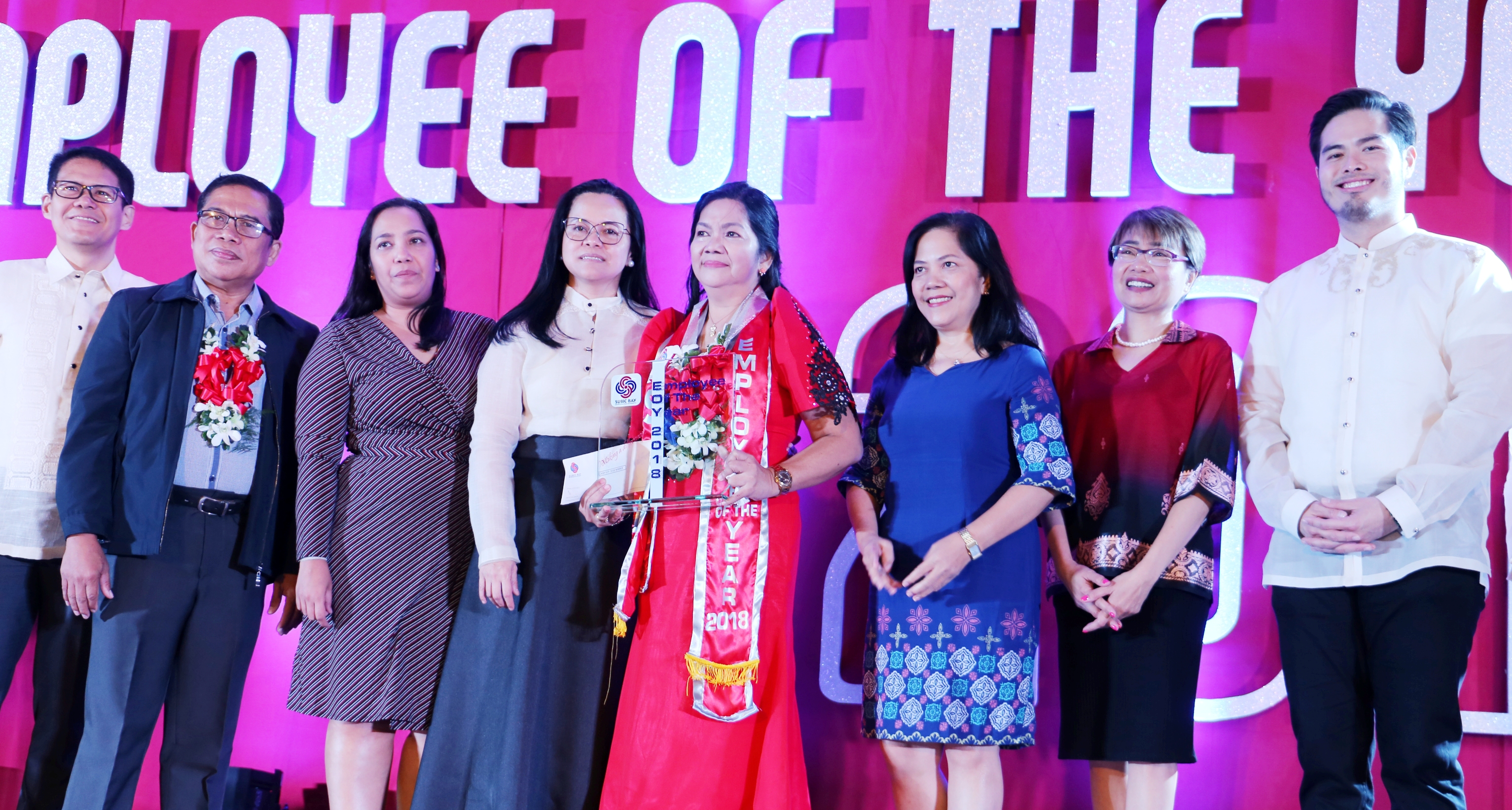SBMA Chairman and Administrator Wilma T. Eisma (4 th  from left) congratulates SBMA 2018 Employee of the Year Nida Linda C. Rojo, along with (L-R) SBMA Senior Deputy Administrator (SDA) for Support Services Ramon Agregado, CSC-Zambales Dir. Jose Gea, SBMA tourism manager Jamelle Camba, SBMA Dir. Ma. Cecilia Bitare, SDA for Regulatory Amethya dela Llana, and SDA for Business and Investment Renato Lee.
