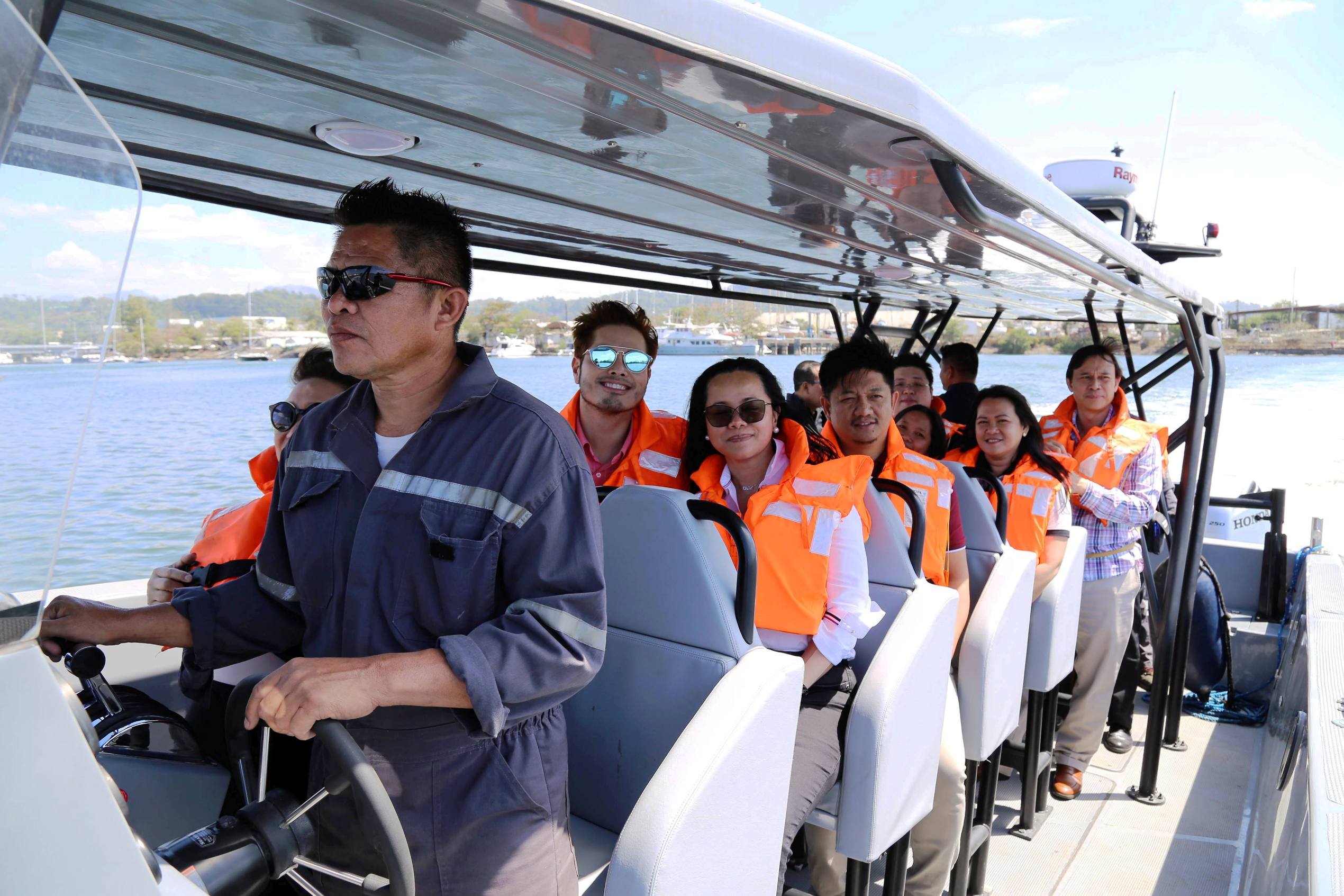 SBMA Chairman and Administrator Wilma T. Eisma and other SBMA officials join Safehull Marine officers in trying out the Subic-made high-speed tactical watercraft