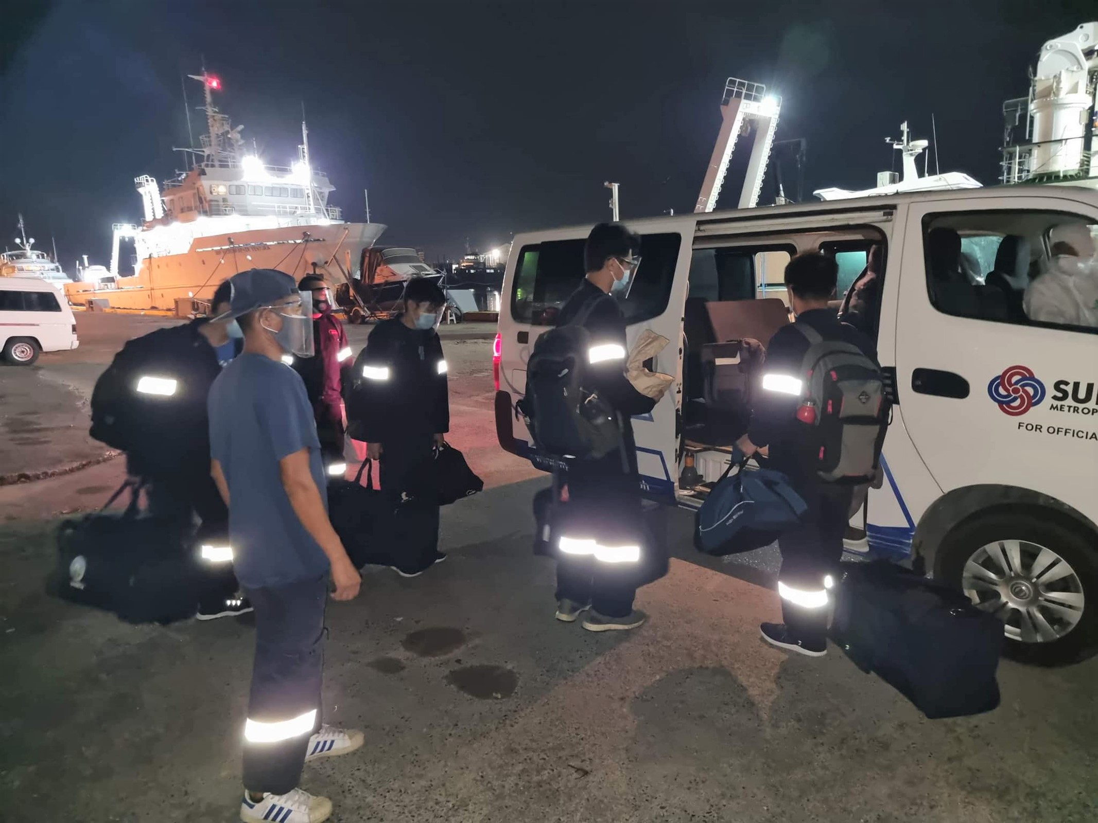 An SBMA Covid-19 shuttle picks up NAMRIA crewmen for transfer to the Manila Times temporary treatment and monitoring facility after 24 NAMRIA personnel in the Subic Bay Freeport tested positive of Covid-19.