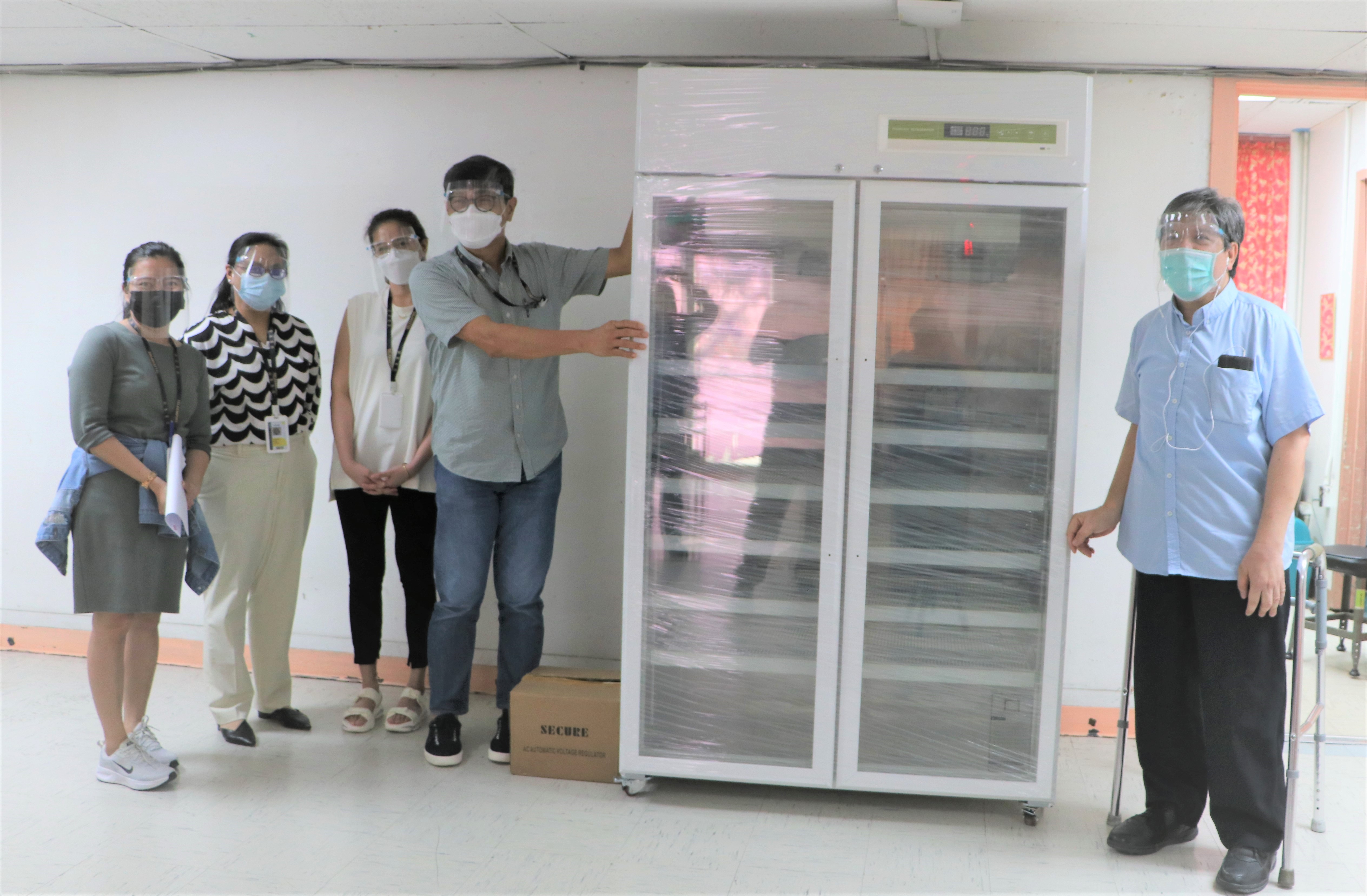 SBMA-PHSD manager Dr. Solomon Jacalne (right) receives the biomedical refrigerator from TeleEmpire officials