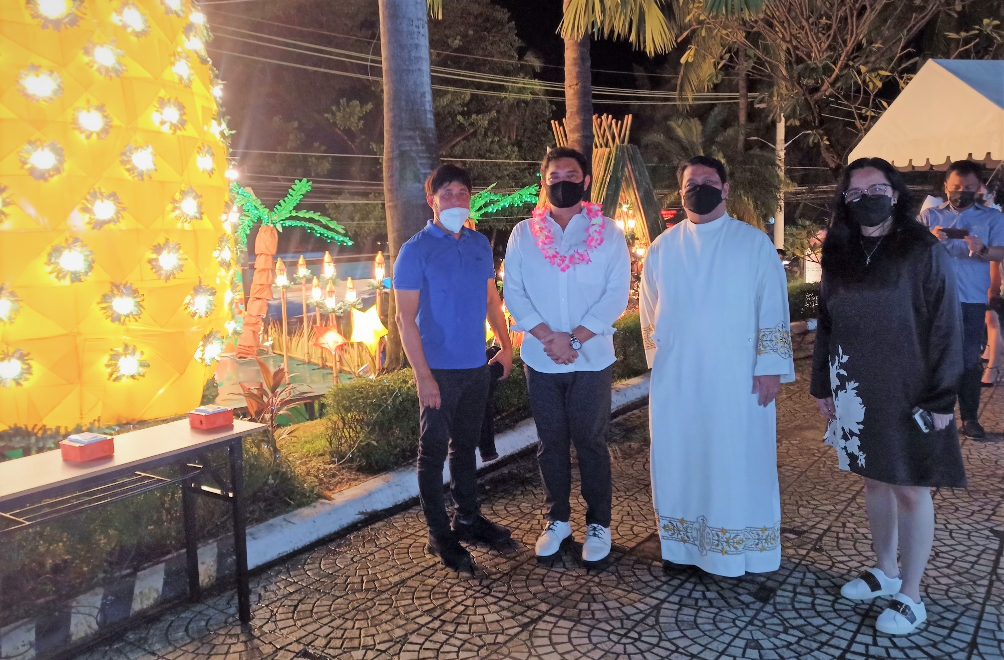 SBMA Chairman and Administrator switches on the lights to illuminate the giant pineapple Christmas display at the Subic Bay Yacht Club on Friday