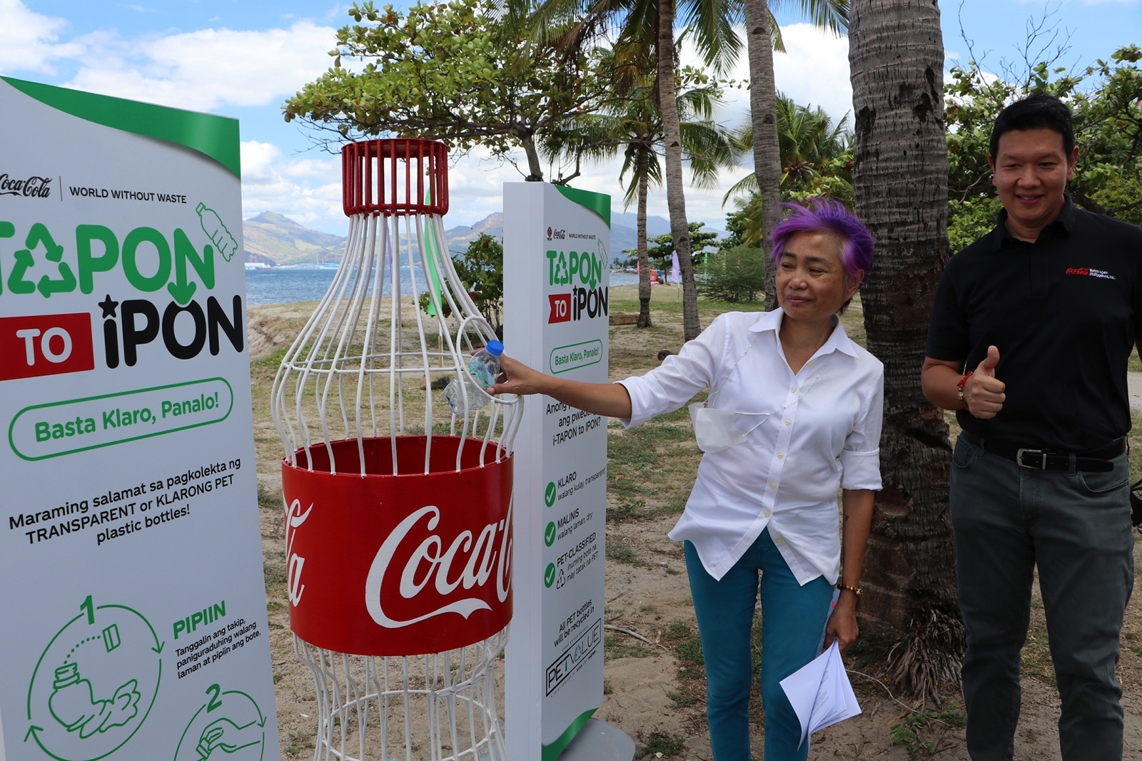 SBMA OIC-Senior Deputy Administrator for Regulatory Group and manager of Ecology Center Amethya P. Dela Llana drops a PET plastic bottle inside the collection bin while looking on is Atty. Marc Anthony Cox, Director for Stakeholders Relations, Corporate and Regulatory Affairs of the Coca-Cola Beverages Philippines Inc., during the launch of World Without Waste Project at the Boardwalk Events Center in Subic Bay Freeport zone on Wednesday, April 27. The project entails setting up of collection stations in different locations within the Freeport zone for the purpose of collecting and recycling pet plastic bottles and aluminum cans sold by the company for recycling purposes.