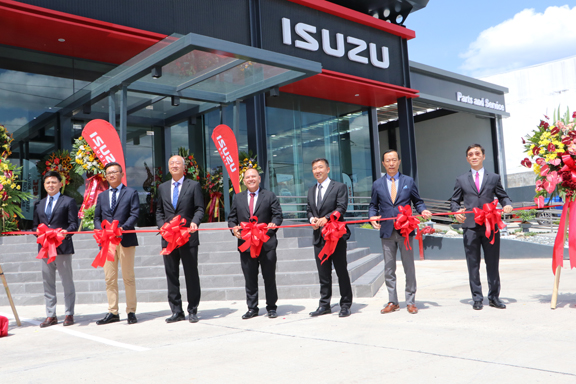 Subic Bay Metropolitan Authority (SBMA) Chairman and Administrator Rolen C. Paulino (center) pauses for a photo opportunity before the ceremonial ribbon cutting, along with other distinguished guests during the grand opening of the P220-million Isuzu Subic Full Scale Dealership.