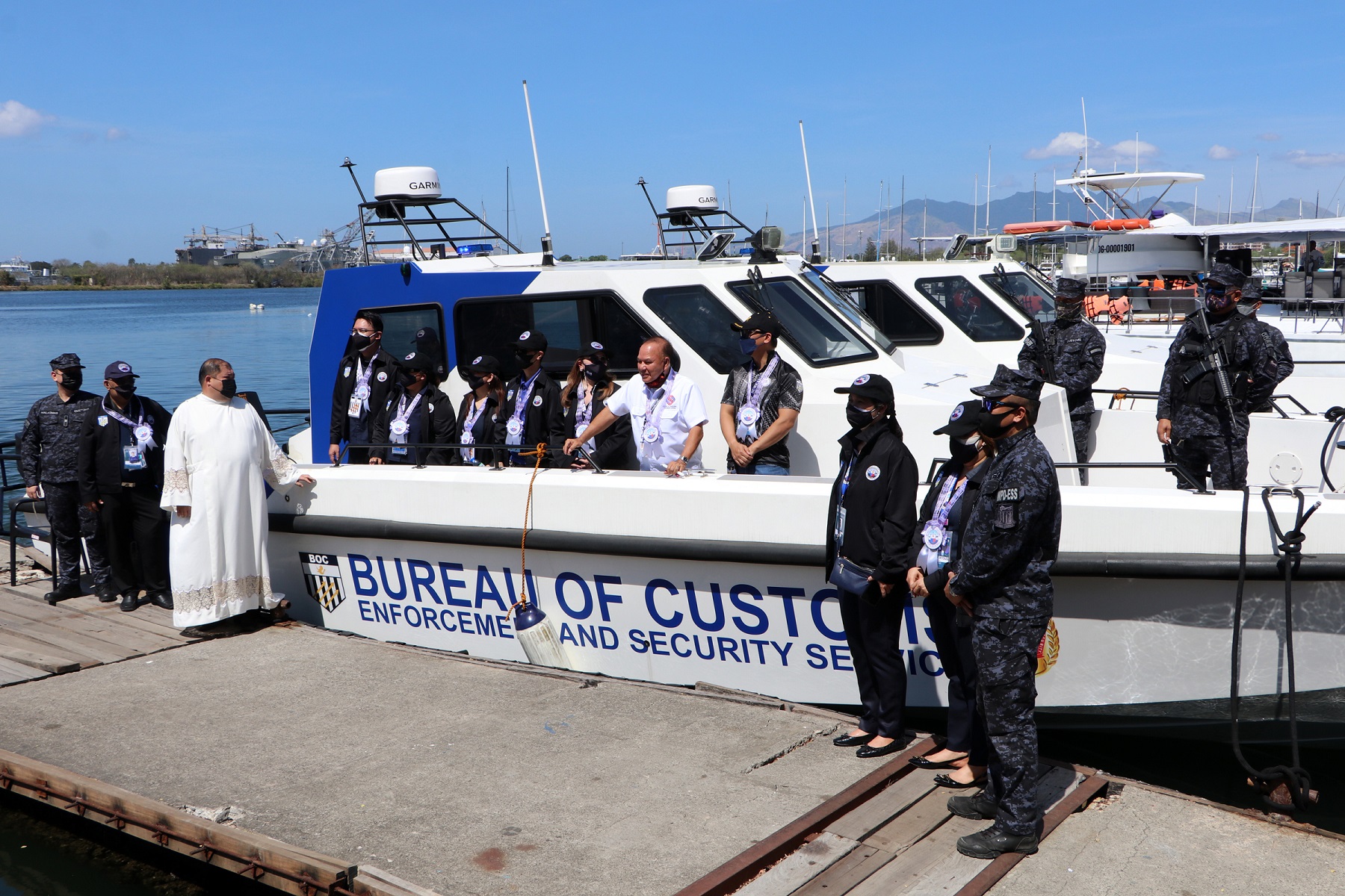 SBMA Chairman and Administrator Rolen C. Paulino along with District Collector Maritess T. Martin of the Bureau of Customs (BOC) Port of Subic and Rev. Fr. Raymann G. Catindig join other BOC officials and personnel for a souvenir picture during the inauguration and launching of two fast patrol boats at the Watercraft Ventures pier Wednesday, May 4.