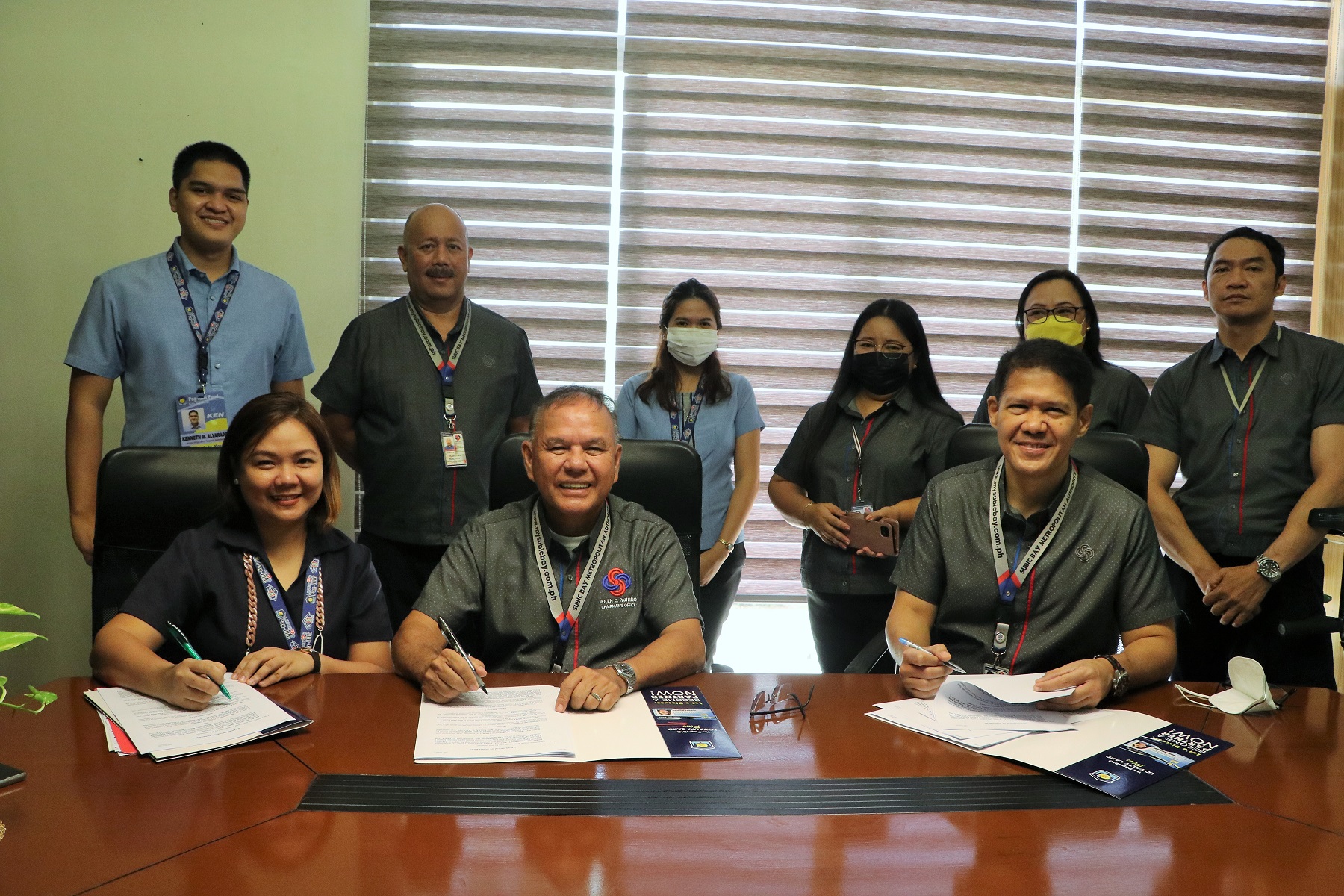 SBMA Chairman and Administrator Rolen C. Paulino and Pag-IBIG Fund representative Sharon Ravelo, on behalf of Pag-IBIG Central Luzon I Area Head Christian C. Chua, sign a memorandum of agreement (MOA) on the Pag-IBIG Fund Online Short-Term Loan (STL) Application program, which will provide SBMA employees a change to loan from the Pag-IBIG Fund, with payments coursed thru salary deduction.
