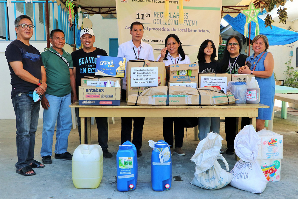 Subic Bay Metropolitan Authority (SBMA) Ecology Center division chief Rosselle Abuyo (center) leads the turnover of proceeds from the 11 th  Recyclable Collection Event (RCE) to its chosen beneficiary, the Missionaries of Charity house in Olongapo City.