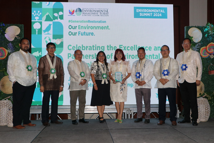 Subic Bay Metropolitan Authority (SBMA) OIC-Senior Deputy Administrator for Regulatory Group and Ecology Center Manager Amethya Dela Llana-Koval (4 th  from right), receives the award from the officials of the Department of Environment and Natural Resources-Environmental Management Bureau (DENR-EMB) Central Luzon in recognition of the SBMA for its outstanding practice in upcycling operations in the Subic Bay Freeport zone, given during the Environmental Summit 2024 held in Widus Hotel Clark Freeport Zone in Pampanga.