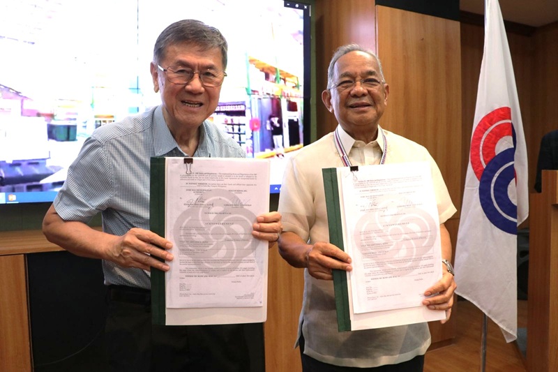 Subic Bay Metropolitan Authority (SBMA) Chairman and Administrator Eduardo Jose L. Aliño (right) and Wilcon Depot, Inc. Chairman Emeritus William Belo (left) flash the lease agreement they signed for the upcoming setting-up of the Wilcon Depot branch in Subic Bay Freeport Zone.